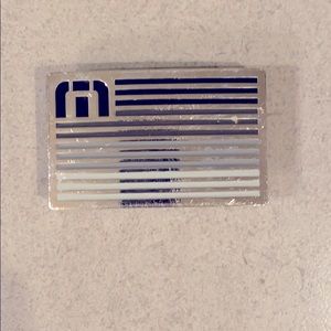 Travis Mathew belt buckles
